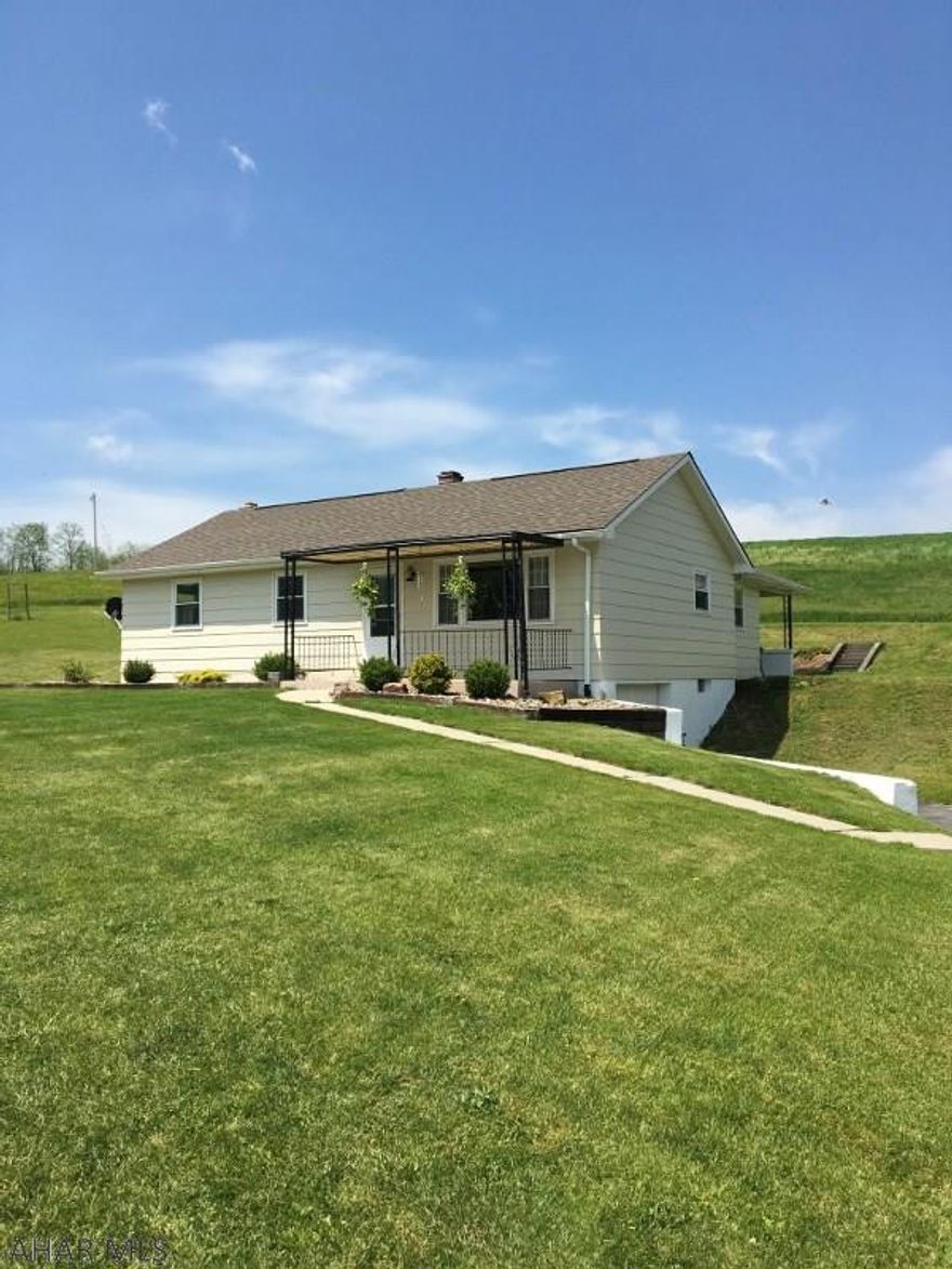 Location is everything and this move in ready ranch home has that and more. One acre yard and lovely views, yet close to everything. Home has heat pump for heat and central air, but also an outside wood furnace for low heat bills. Newer roof, new windows, updated inside. Don't miss this great rancher.