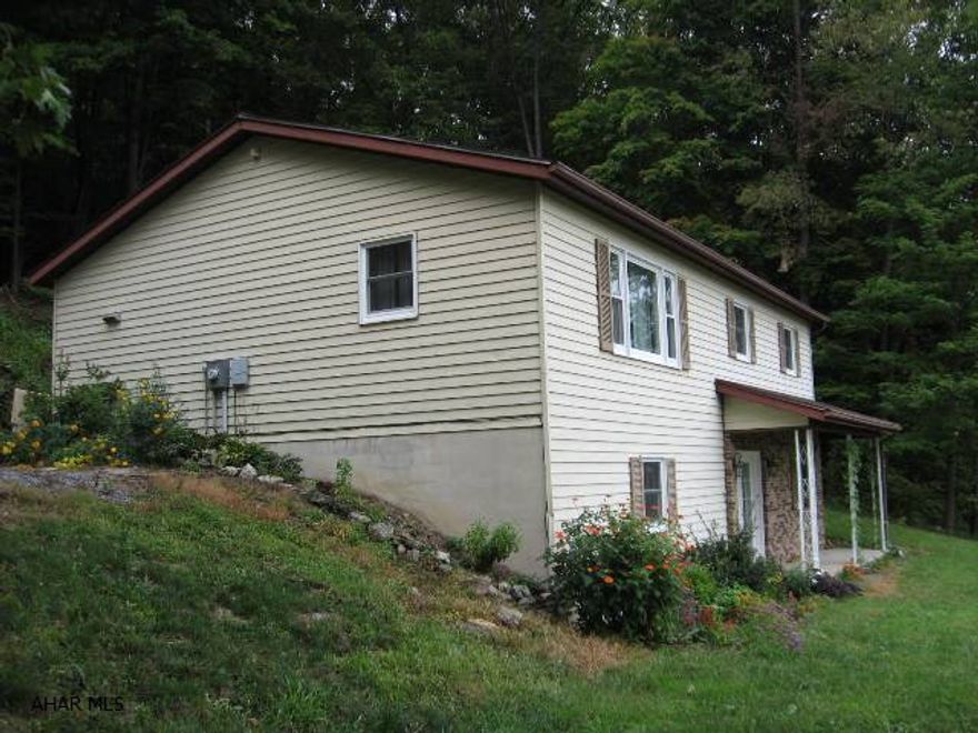 The perfect choice for a first time buyer or someone looking to downsize.  This home has been very well maintained and has many upgrades:  Newer Windows, Roof in 2007, Outside Hot Water Woodburner in 2009, Radon System, Large spacious Family Room w 3/4 Bath,  and additional lot for added outdoor space.  Country views yet only minutes from the Bedford Springs Hotel and Downtown Bedford.  A must see home!