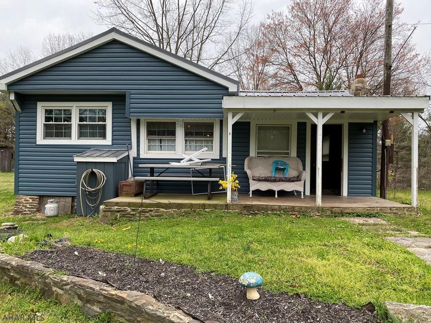 Looking for that perfect getaway, this is the place for you . A 3 bedroom 1 bath cabin with new siding and roof - Private 9.7 acres to do as you please. Gorgeous views for miles and wildlife all around.  Only 35 Minutes to Rocky Gap Casino Resort and Berkeley Springs.  Close to State Game Lands. Sold "As Is"