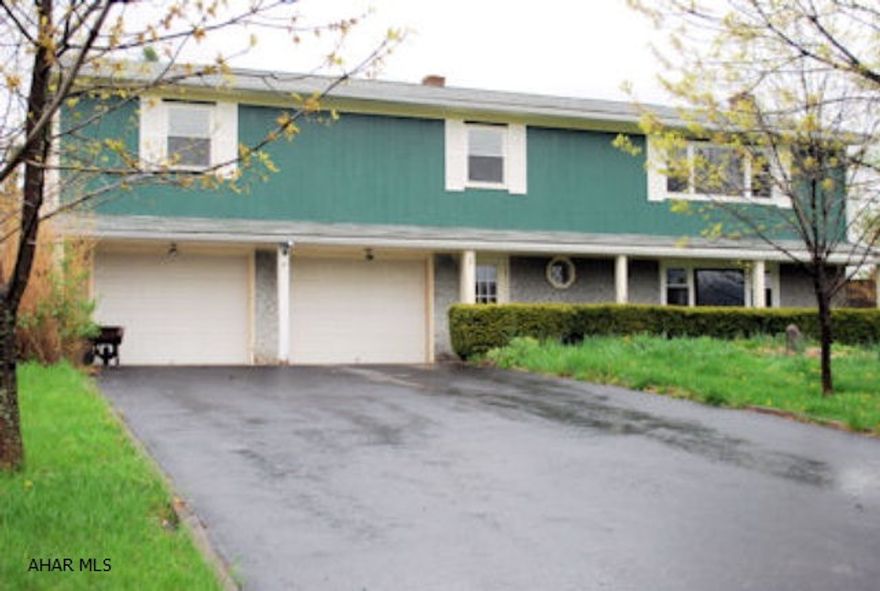 Country property with beautiful views.  Large rooms, replacement windows, nice sunroom.