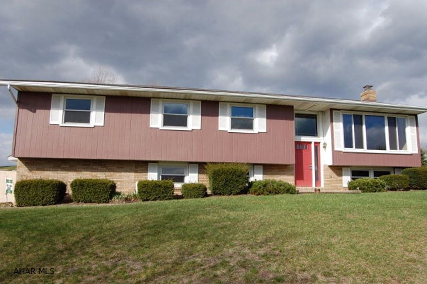 Just reduced $10,000. Looking for a great 5 bedroom home in the Hollidaysburg Area School District? Large split-entry home with newly renovated basement (new drywall, carpet and paint). New carpet throughout the entire house.  Beautiful hickory hardwood floors in the bedrooms.  Remodeled bathroom, new insulated garage doors, top of the line recently installed thermo pane windows with triple pane french sliding doors off dining area.  Located on dead end road and offers exceptional panoramic views of the mountains. Did I mention the garage is big enough to fit 3 cars and offers an extra room for great storage area?  Don't wait on this beauty. Pack up and move right in. Also qualifies for USDA (rural housing loan).