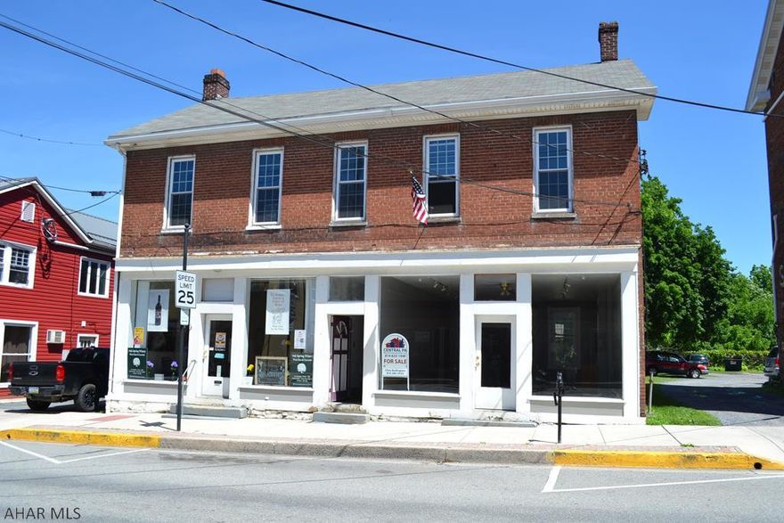 Commercial space located in the heart of Historic Downtown Bedford.  A mixed use building with 2 store fronts and 2 residential apartments with off street parking.  Additional rental income possible with the expansion with unfinished units.  Call for details.