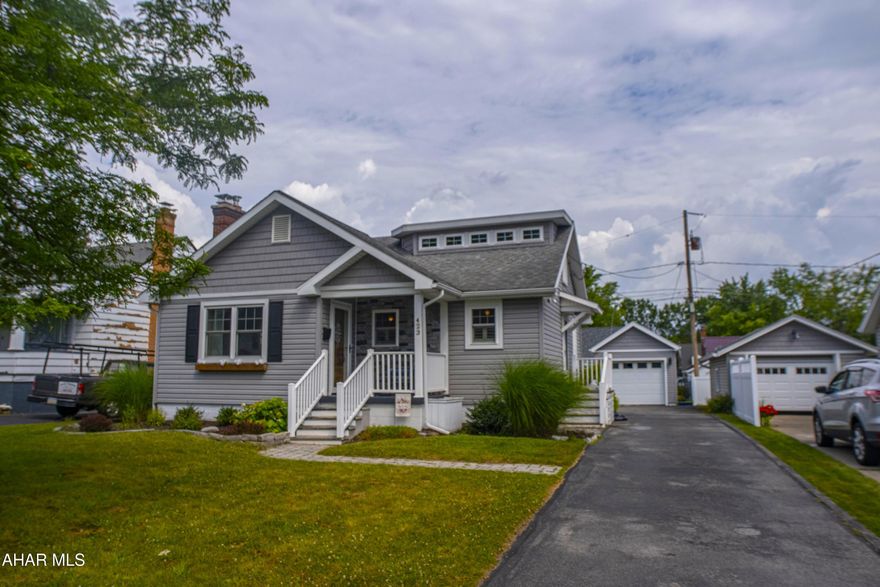 MOVE-IN READY GEM 
IN HOLLIDAYSBURG BOROUGH!! This chic 1 & 1/2 story completely updated home in the sought-after Hollidaysburg Borough is conveniently located in close proximity to C.W. Longer Elementary, Hollidaysburg Jr. & Sr. High, Tiger Stadium, Hollidaysburg Library, YMCA, downtown Hollidaysburg, Legion Park & more! This home features: 3 bedrooms, 2 full bathrooms, the primary bedroom has it's own bathroom with easy access to laundry & a sliding glass door to covered deck - perfect for relaxing with your morning coffee!! The living room & kitchen are open concept & the kitchen features all LG black stainless steel smudge-proof appliances, marbled tile back splash, & Corian countertops. This home also features a spacious finished basement with laminate flooring - perfect for entertaining guests, office space, a playroom, recreation room, etc. There is also a large unfinished room for storage. The detached garage could be used for your car, storage, or a workshop! The fenced-in yard is perfect for your pets!! Schedule your showing today!!