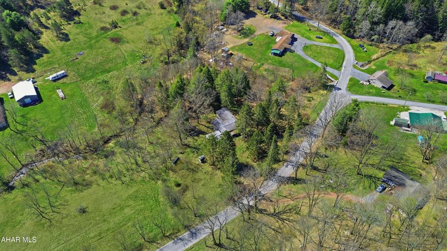 Discover 2.7 acres of beautiful land in Barr Township offering a great blend of privacy and accessibility. This property features excellent road frontage and a small stream running along the rear of the parcel, creating a peaceful setting with plenty of potential. An existing home is currently on the property but has been vacant for quite some time and will likely require demolition. Whether you're looking for a future home site, weekend getaway, or camp location, this property presents a great opportunity. Call today for more information!