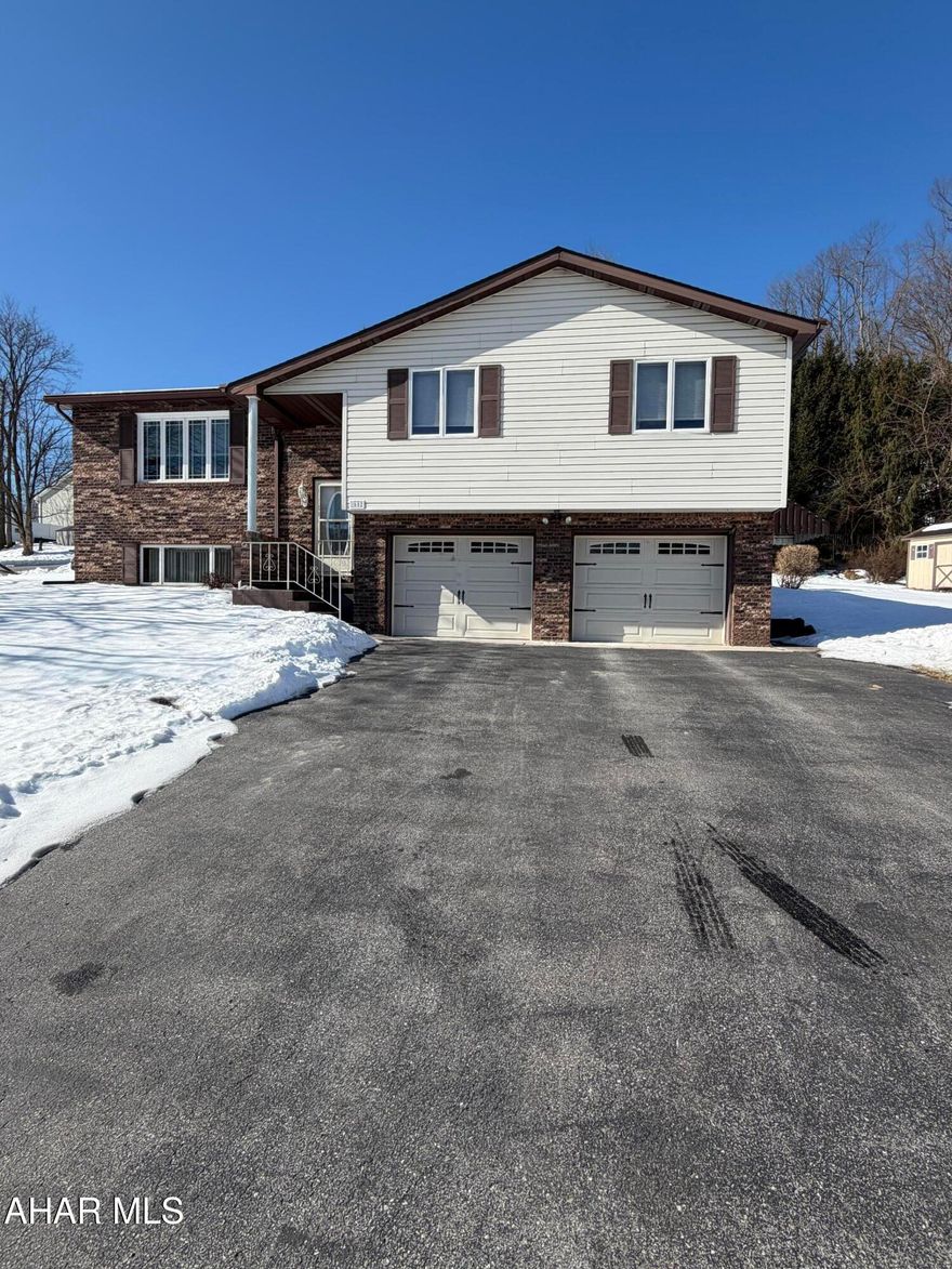 Welcome home to this beautifully maintained 3-bedroom, 2.5-bath residence located in one of the most desirable sections of Altoona. This move-in-ready property features a custom oak kitchen with all appliances included, spacious rooms, hardwood floors, and a finished basement complete with a cozy gas fireplace. Numerous upgrades add peace of mind and value, including new carpet, new appliances, a newer furnace, hot water heater, well pump, and roof. Enjoy plenty of closet space, a full basement laundry area with appliances included, and an oversized two-car garage with a workshop. Step outside to a professionally landscaped yard and unwind on the large, half-covered deck—perfect for relaxing in comfort and privacy. Conveniently located just minutes from shopping, dining, I-99, and area attractions, this home offers the perfect blend of comfort, convenience, and quality. (taxes and sq footage must be verified by the buyer)