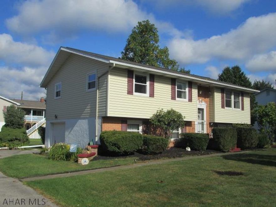 Immaculate 4 bedroom bi-level in desirable Hollidaysburg. Upgrades abound in this cute home. Eat-in kitchen, formal dining room, spacious living room and lower level family room w/bedroom and 3/4 bath. Rear patio features new awning which is included in the sale. Covered carport for car, trailer or motor home. And best of all this house is within walking distance of schools, public library and Legion Park.