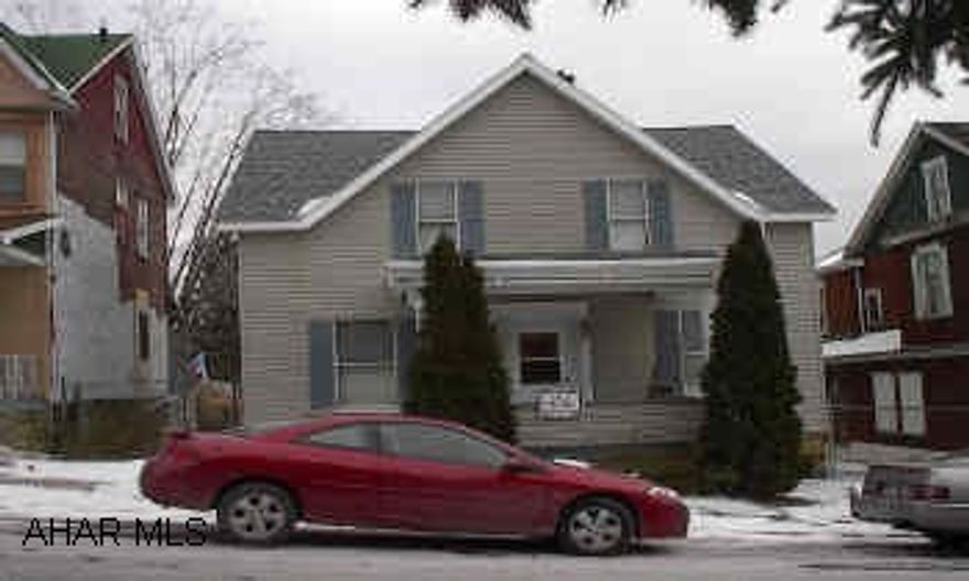 Solid House with many extras:  40 year composition shingles installed fall of 2002, house is very well insulated, covered front porch and partially covered rear deck, above ground pool, gas fireplace in family room, wall to wall carpeting, and much more.  Many updates throughout the house.