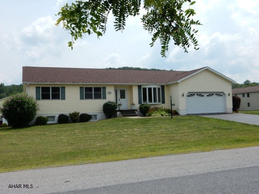 This custom built ranch designed by the original owner is located in the Helsel Development.  Sitting on a large, level lot, this home offers a formal dining room and a great kitchen with eat in area, lots of windows, cabinets and light.  A spacious family room looks out over a covered and screened 17 x 12 deck.  The master bedroom offers a walk in closet, in addition to a second closet, and full master bath with oak cabinets and vanity area.  The basement is extremely large with work shop area and a third bay garage area that gives opportunity to complete to your liking,  with endless possibilities.  This home has a 3 year old roof, has been freshly painted throughout and been meticulously maintained.  It's possible that this home sits on the line Hollidaysburg school district line.