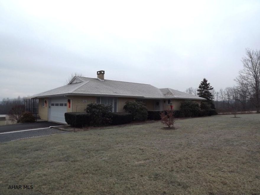 Large and open brick ranch with exceptional views! This three bedroom, two and a half bath offers 2,300 square feet, walk out basement and sits on one acre. Move right in... exceptionally maintained.