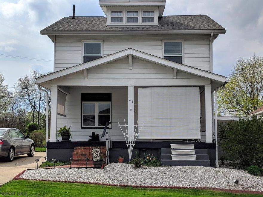 Lovely home with tremendous character and charm situated on two double city lots - impeccably landscaped with flowers and apple trees. It's a taste of country living within the city limits. The house offers a spacious front porch with blinds for shade during Summer months and a large back deck. Inside, notice the detailed wood work throughout with built ins and a gorgeous staircase leading to the second floor bedrooms & bath, accented by a stained glass window. On the first floor, you'll find the living room, dining room with large windows and an eat in kitchen with ample storage space. There is also a small sun room that leads to the back deck and a large unfinished attic. (*the second double lot with apple trees is located directly behind the house, across the alley)