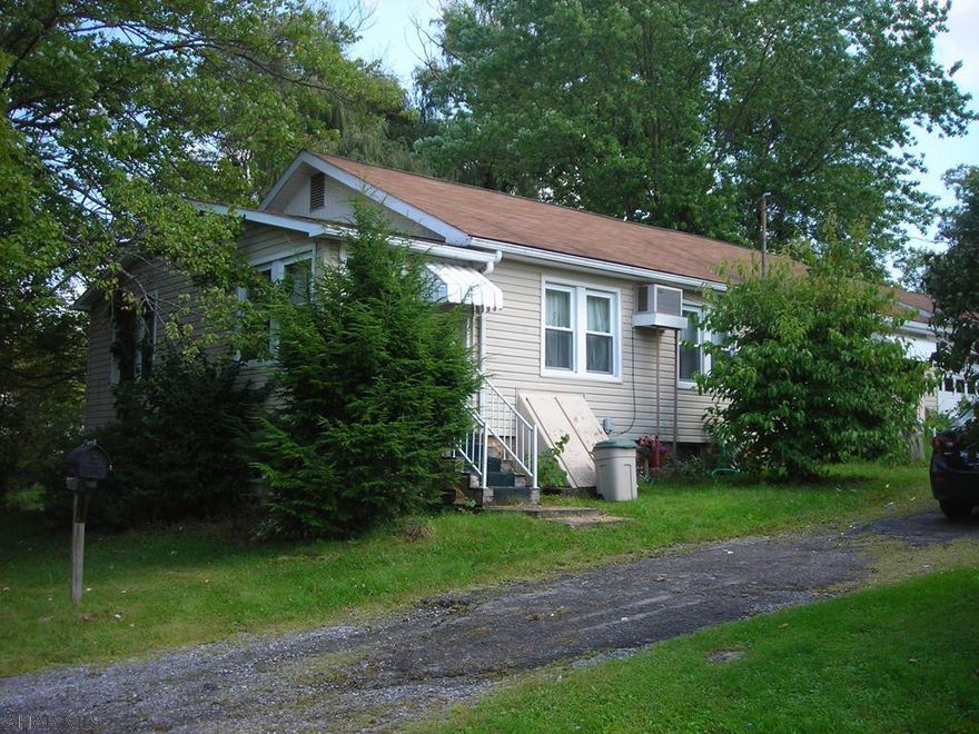 Nice quiet area, walk to Curve games. This 4 bedroom one story could use personal ideas and some TLC. Comes with 3 parcels (total) .56 acre. Build on one and keep the others . Zoned Residential/Commercial. Property listed according to recent real estate appraisal. The ground makes it a special buy. Consider all the options.