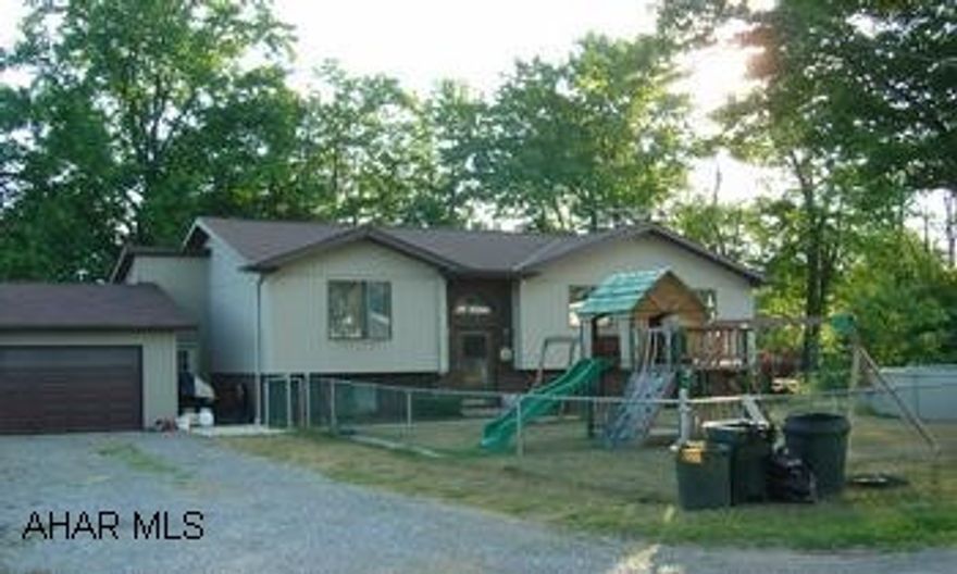 2.5 Acres 4 Bedroom 2 Bathroom home with 2 Car Garage.