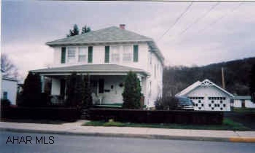 Attractive 2 story 3BR home in a handy in-town location w/detached 2-car garage and professional 32'x26' workshop.