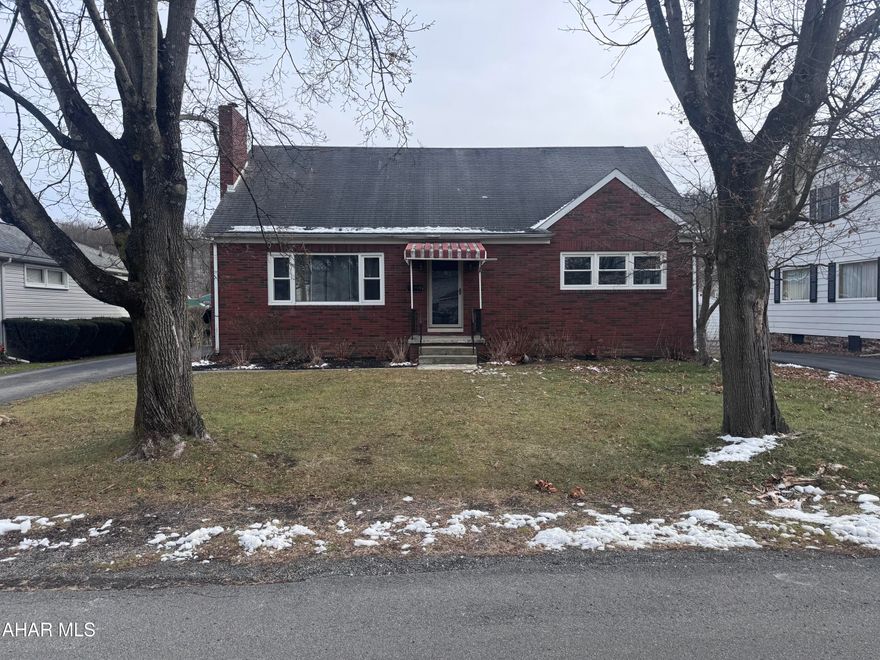 Brick home with double lot (.34 acre) in Hollidaysburg school district. 4 spacious bedrooms with 2 full baths. Wood burning fireplace in the spacious living room with hardwood floors. Large back covered deck. This is a must see.