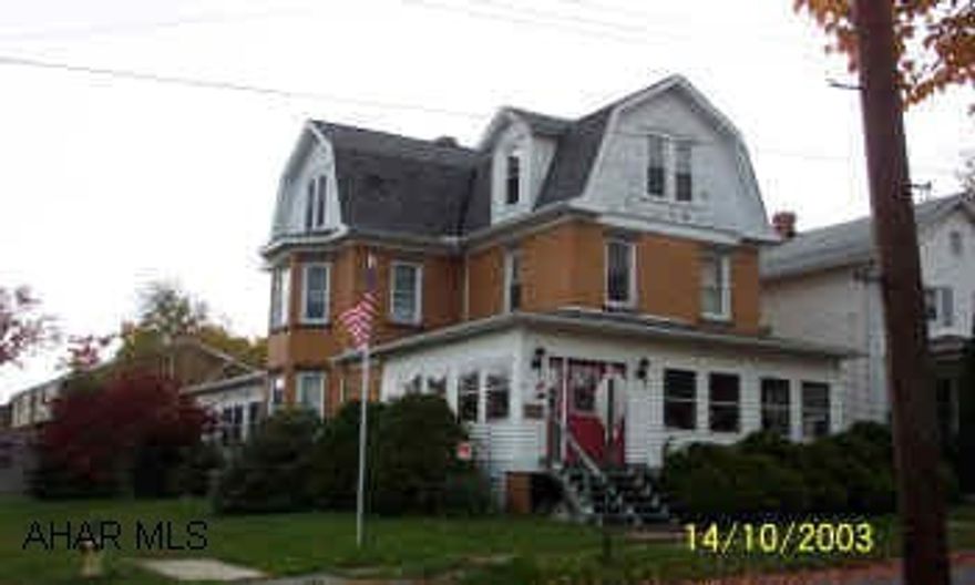 Stately 3 story on a corner lot with  1 car attached garage, 1 car detached garage,  New kitchen.  Very spacious!
