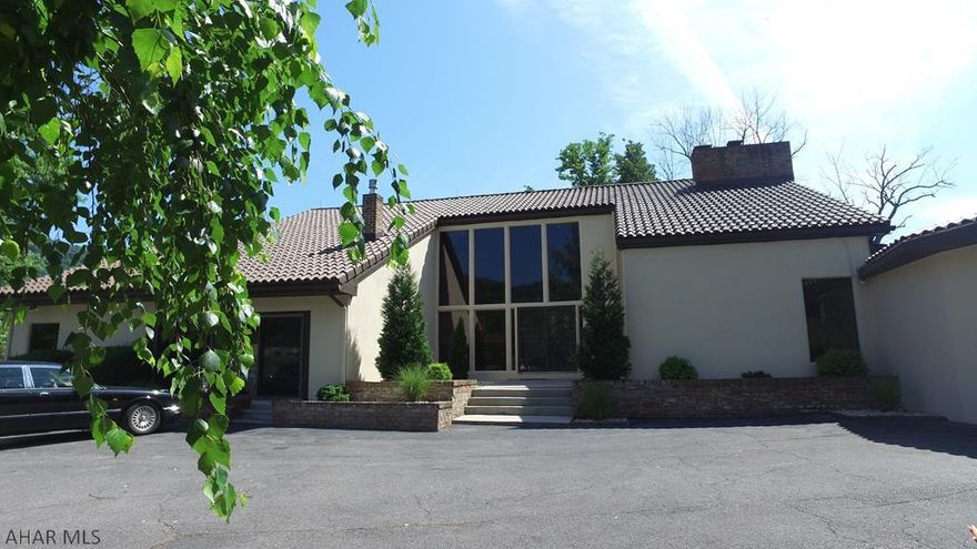 One of Bedford's most gorgeous homes along the waterfront, sits this amazingly privately located contemporary home less than 5 minutes from historic downtown Bedford.  This is an extraordinary 4 bedroom 4 1/2 bath home with walls of glass that take in breathtaking views of the Blue Juniata River.  Most rooms enjoy fabulous views of the river front as well as the beautiful in ground pool surrounded by fenced rod iron stone terraces and lush professional landscaping.  The property includes 2 master suites which have private balconies, gourmet kitchen and huge dining area.  Could be the most amazing Bed and Breakfast or Wedding venue resort.