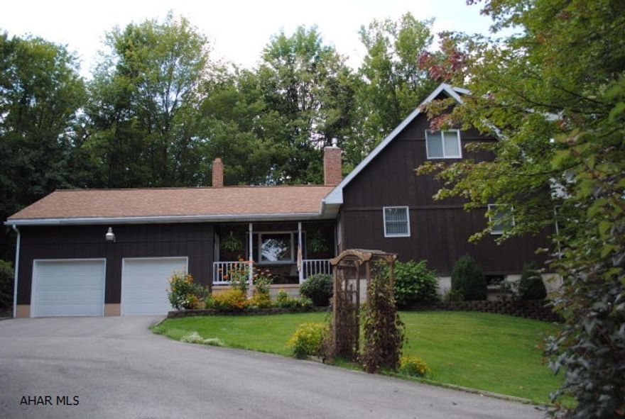 Custom Built Bellwood Home on 8.2 acres! This home offers LR w/Beamed ceiling, HWF & floor to ceiling brick fireplace, DR w/HWF, EIK w/appliances,1st floor Den, One story living w/1st floor full bath and bedroom, 2nd floor offer 2 spacious bedrooms and another full bath! Lower level family room w/ wood burning fireplace and wet bar! Plus screened porch and deck area to view the beautiful surroundings!