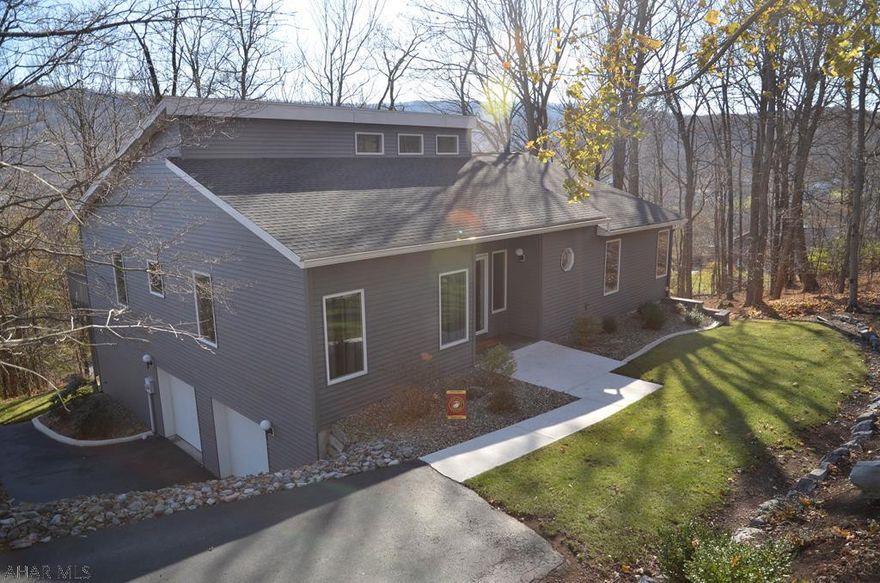 Superbly maintained & updated contemporary home overlooking Bedford!! Double lot, mountain views, & peaceful setting!! Foyer w/ double door windows; great room w/ vaulted ceiling, recessed lights & fireplace; dining room; kitchen w/ updated s.s. appliances, corian counters & breakfast nook; master suite, w/ large closet & m. bath; bedroom and another bath. Lower level offers a huge bedroom w/ bath that could be an in-law suite or another master suite; office; large mechanical room (could be finished), & a 2-car integral garage. Newer shingle roof (8-18), all refinished oak floors, new kit. appliances, interior paint, water heater, patio & landscaping. Custom, quality home, loaded with amenities. Short stroll to the downtown area restaurants and shops!!