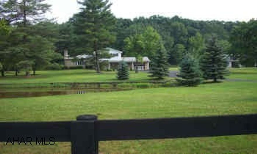 Beautiful 3312 sq ft split level 4BR, 2 Bath home with 2 stone fireplaces, Lg 37 x 27 great room, lg. pond, stone patio, 33 x 21 2 story barn with attached 1 car garage, shed, paved driveway all on a peaceful, fenced 4.76 acres. Easy access to I-99. Beautiful 3312 sq ft split level 4BR, 2 Bath home with 2 stone fireplaces, Lg 37 x 27 great room, lg. pond, stone patio, 33 x 21 2 story barn with attached 1 car garage, shed, paved driveway all on a peaceful, fenced 4.76 acres.   Property sold as is. Easy access to I-99.