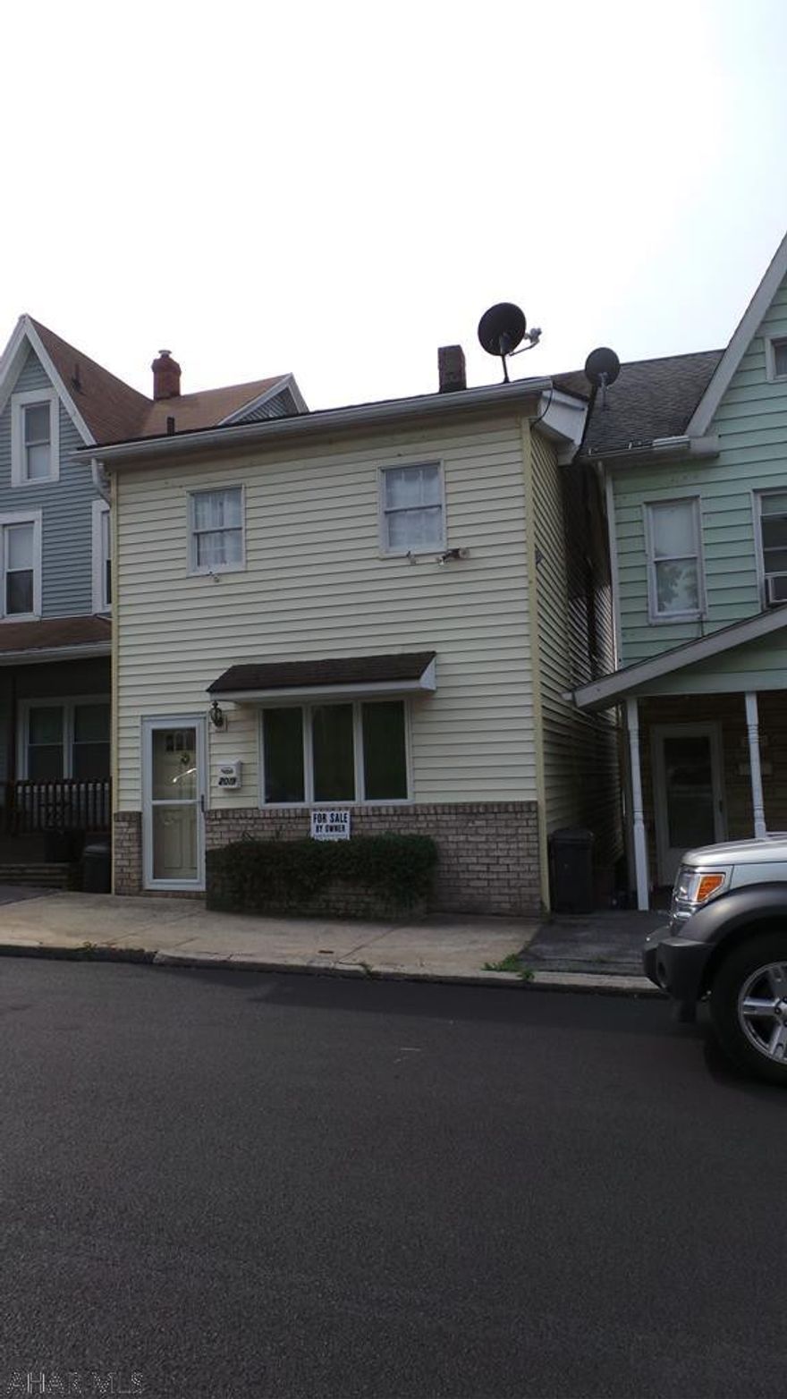 Large living room with laminate floor - laundry on 1st floor, large bedroom on 2nd floor.  Great space in this home.  Sold "AS IS"