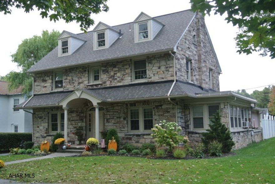 WoW!  A Magnificent Stone home in one of the most Prestigious neighborhoods in town!  Location! Location! This Outstanding,superior built home delivers so much of its original Classic character mixed with its all new updates throughout.  If you're looking for a beautiful home with vintage attributes but didn't want to deal with old house updates....THIS HOME IS PERFECT for you! Check this out!..Brand new traditional style Kitchen with Granite & classic ceramic flr, Refinished Hardwoods all through home, Updated bathrooms maintaining vintage character, Fireplace finished in time-honored stone and updated to gas, newer grid style windows, updated wiring, plumbing, heating, light fixtures and more. Plus..hidden away in the basement level.. is a fantastic finished rec room with a custom bar!
