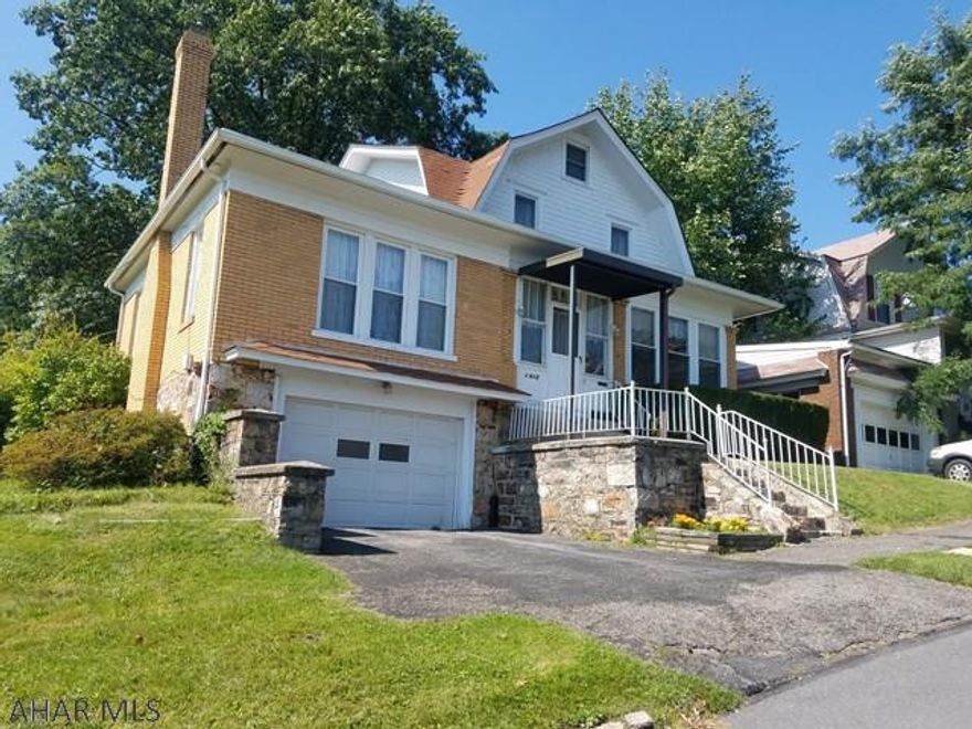 Charming 2 story brick home with FOUR CITY LOTS!!!  You must see this home!  3 bedrooms 2 baths with a 1st floor master. Built-in front porch for a peaceful view of the hillside all year long. Spacious living room with the original working fireplace and dining room great for entertaining.  Call today!