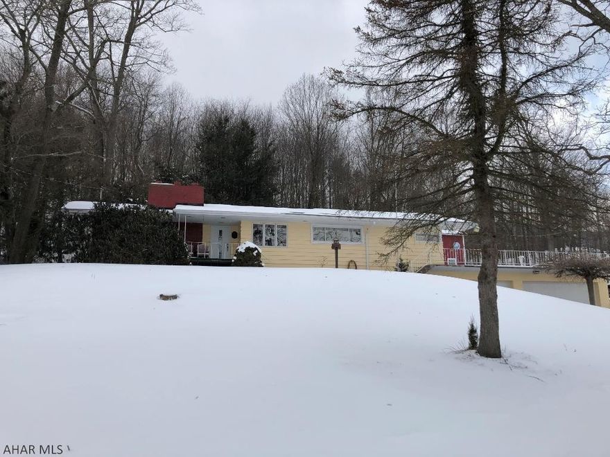 Well maintained, open concept floor plan, with beautiful mountain views are a few of the qualities this ranch home has to offer! This 2 bedroom 2 bath property has a sunken living room with fireplace, dining room with french doors leading to the back patio, roomy kitchen with mountain views out the broad windows, 3 car garage, finished basement with kitchen, family room, and nice sized bonus room, (had been a beauty shop), the basement could be a nice in-law suite or an apartment. Watch the sun rise from the covered front porch, have friends and family over for cook outs on the terrace or back patio. The large 2 story out building with garage door, has a workshop and plenty of storage. Close to Raystown Lake and Trough Creek State Park.