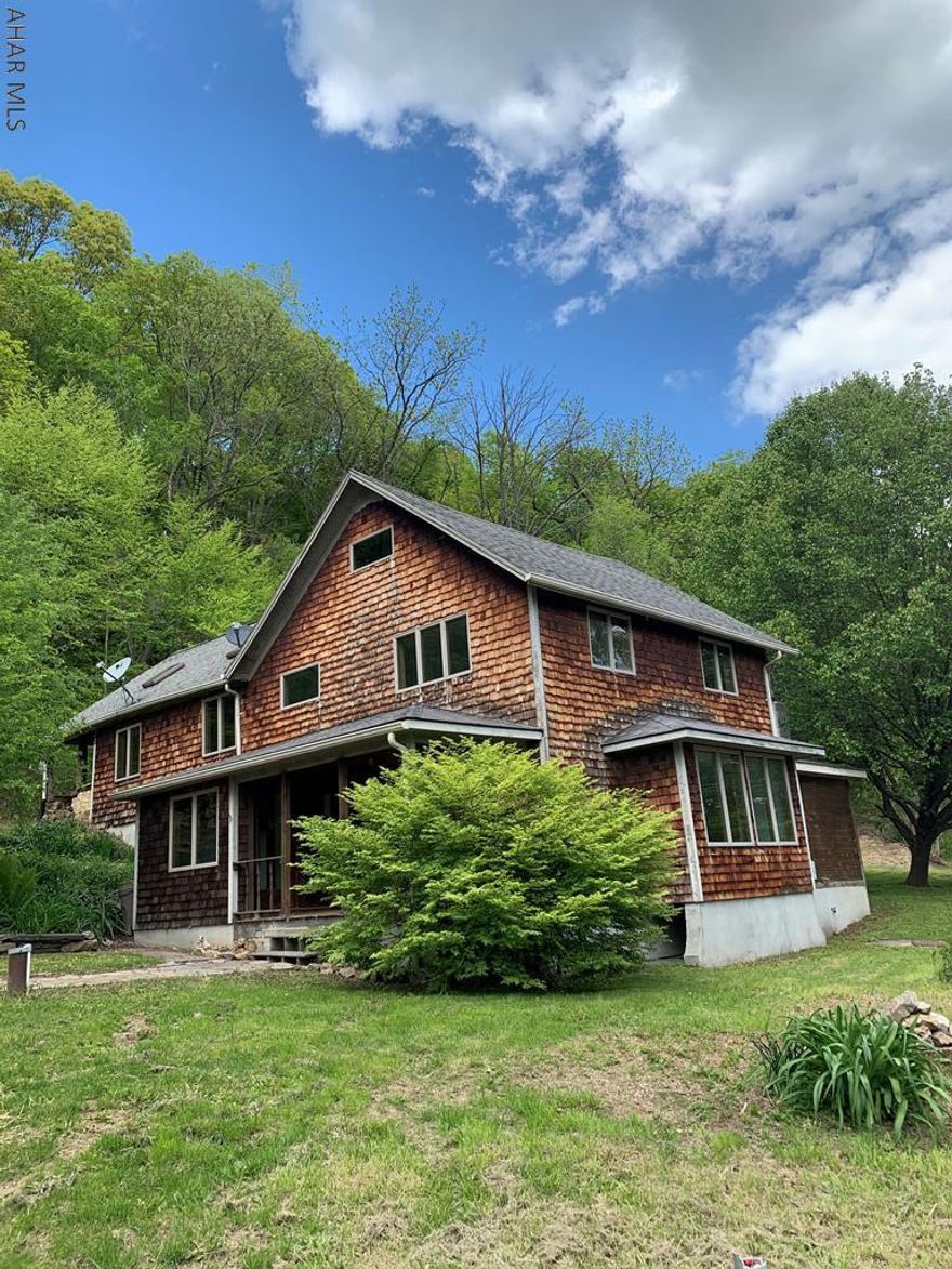 Make it the way you want!! Possibilities are endless.  This large 2 story home has spacious rooms situated on 1.5 acres just out of downtown Bedford. Main level foyer, flowing into the living room and dining area.  Great kitchen space with a pantry.  First floor full bathroom.  Workshop/utility room going outside to your side patio.  Second floor you can use your imagination!! Could potentially be 5 bedrooms with another full bath... or could be a great room with multiple bedrooms.. or a large master suite with guest area.  Great outdoor space with a shed. You do the finishing touches!! Come on what are you waiting on.. your home sweet home is waiting for you!