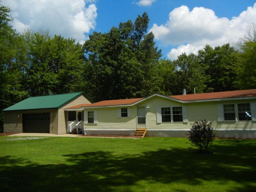 LOTS FOR THE MONEY!!!  Sportsman's dream home situated on 1.3 wooded acres, close to state game lands!  Large rooms throughout (1675 SF). Walk-in closets in all bedrooms. Oversized garage with loft and workshop area.  Shed with electric.  Nice screened breezeway.  Kitchen provides lots of cabinets and counter space.  Electric (subpanel) in garage too.