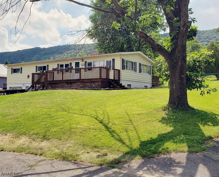 REDUCED AGAIN!! This beautiful 3 Bedroom, 2 Bath mobile  home is located in a peaceful environment and with some minor TLC, would be a great house to make lovely memories in. The house has a large yard, stunning mountain views, multiple decks, and even a pool to help make for a relaxing atmosphere. Home has ample storage space with lots of closets and a spacious basement with shelving. This well-maintained house has been freshly updated over the years to accentuate it's beauty. With this price, the opportunity isn't going to last long, so make your appointment to tour this home today, because your search is over! Sold "As Is" Great Investment!