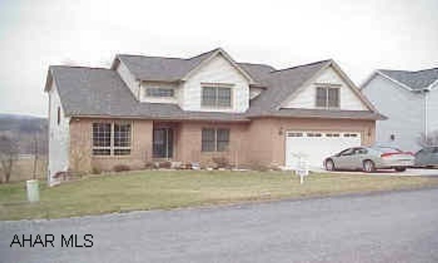 Beautiful oak woodwork throughout, solid six panel doors, and custom book shelves in the Family Room.  Terrific floor plan which is open and bright.  A center island with granite counter top.