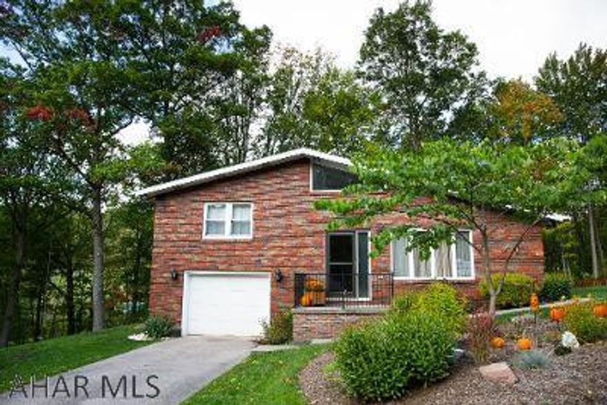 This beautiful all brick home with two large garages sits on a large parcel with easy access to commuting. The inside layout is open and you'll love the professionally installed Brazilian Cherry hardwood floors. A full finished basement with a 3/4 bath and laundry make the perfect area for crafting, gaming, entertaining and more. Enjoy beautiful evenings on the back covered porch with a lovely wooded view. This house is only waiting for you to call it a home. Call the listing agent for your private tour today.