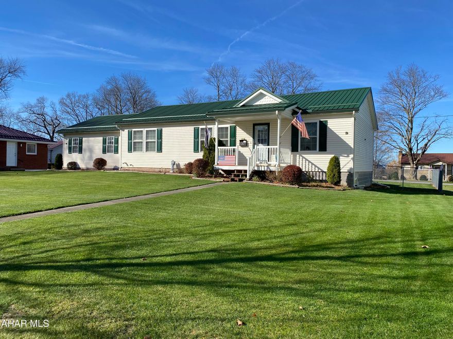 Nicely maintained modular home built in 2004 with large two car attached garage with access from the road behind the home, exterior is meticulously maintained with large flat yard, covered back porch with fenced in backyard that is perfect for entertaining or enjoying a warm fall day, semi-open floor plan, laminate flooring, owner bedroom with 3/4 bath, finished basement with bar, bedroom and full bath