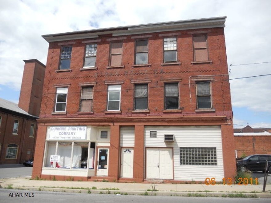 Selling property AS IS condition. Former printing shop with apartments - apartments are vacant and need work. Great opportuinty to own a commercial property.