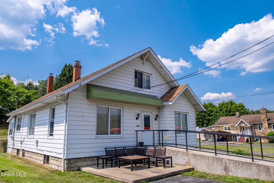 This prime commercial property in the Greenwood section of Altoona provides a high traffic and high visibility location, making it an excellent investment opportunity. The property features a paved parking lot and a handicap accessible ramp, ensuring convenience and accessibility for all. With multiple streams of income, the property includes a commercial space at the front, a 3-bedroom apartment at the rear, and a detached garage, offering diverse rental opportunities. Situated in close proximity to Sheetz and Dollar General, this property has enhanced visibility and convenience, making it an attractive option for both tenants and customers.