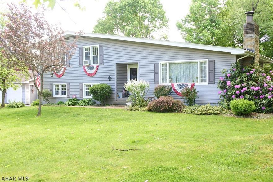 Well maintained, Multi-level home on a BIG corner lot. 3 BR, 2 BA, LR, FR and a bonus room that could be a 4th BR, home office or an in-law suite. Updated  Cherry kitchen (appliances stay), ceramic and Hardwood floors...gas FP. Lower level is perfect for kids...lots of space for everyone. Enjoy Summers on the covered patio...great views of the mature trees and maybe see the  Del Grosso Fireworks!  Detached garage is a great space for the car enthusiast...lots of room for puttering, too!  Lots of house...lots of space and lots of yard!! Move in ready.