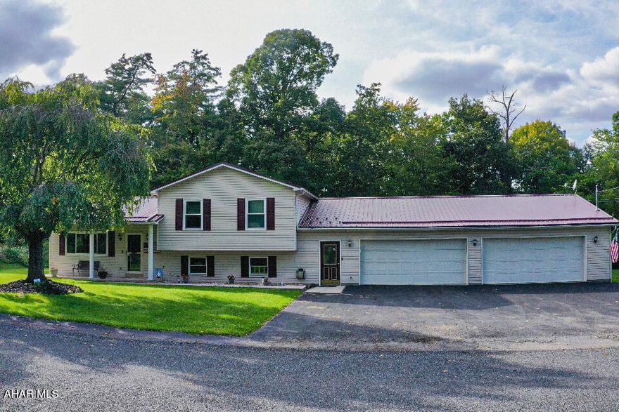 Welcome to your dream home! This impeccably maintained and move-in ready residence can be yours! 3 bedrooms, 2 bathrooms, a finished basement with a wet bar, AND a huge 4-car garage! There is also a bonus room located between the garage and mudroom, perfect for your ideal at-home office or additional storage. The master bedroom, features a generously sized walk-in closet, the bathroom features a skylight, and the kitchen has a pantry. This home has everything!  As you explore the outdoors, discover a private oasis in the backyard! The large deck allows for a great living area to relax or entertain!