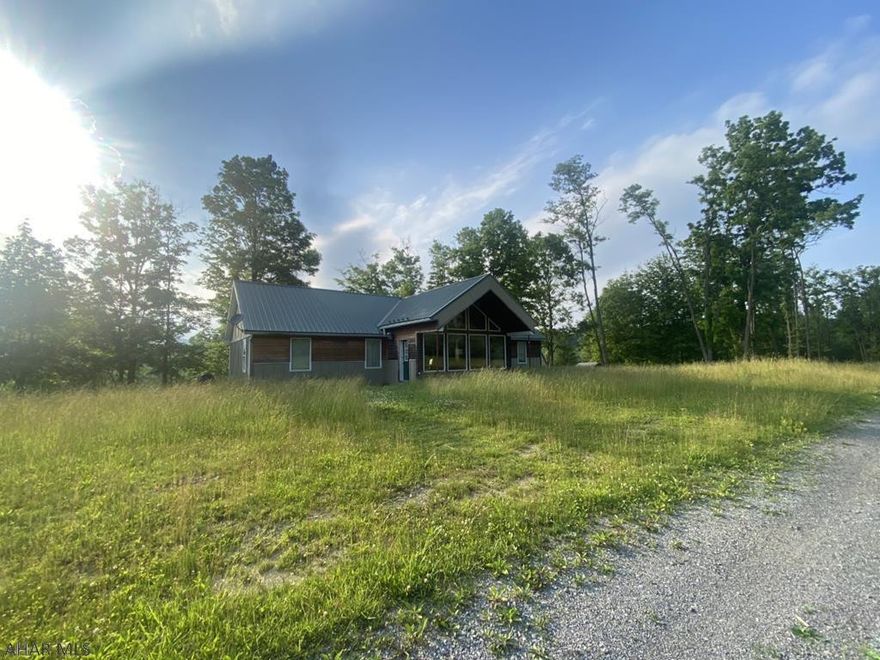 Situated on over 26 acres this one of a kind home in Frankstown Township has so much to offer.  The First floor is separate from basement for unlimited potential.  Natural light, hardwood floors, open floor plan, large outbuilding, and easy to maintain exterior are just some of the many features this property has to offer.