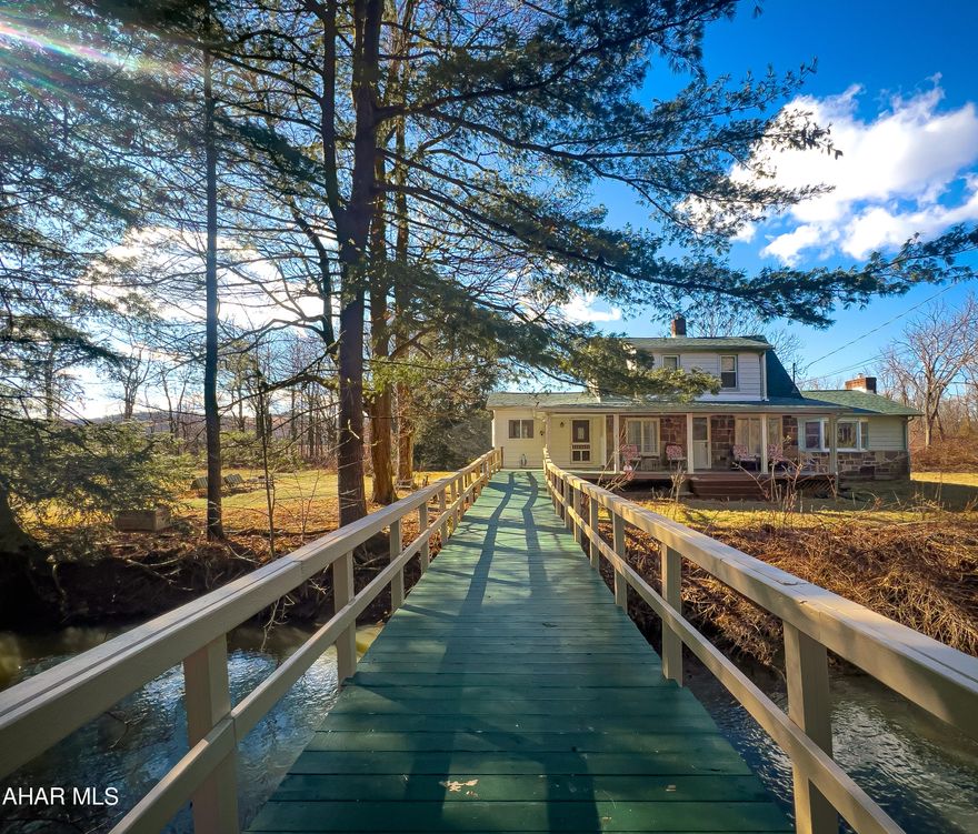 This one of a kind 20-acre three-bedroom home offers first floor primary bedroom, a beautiful updated full bath with double vanities, dining room, living room and kitchen. The kitchen has been updated with newer LG stainless steel appliances, quartz countertops, mosaic backsplash and original cabinetry. The dining room has a full wall to wall row of cabinets with quartz countertop. The large living room features a wood burning fireplace encased in solid red brick and a front facing bay window providing plenty of natural light. The front of the house has a light-filled bonus room. The second floor shows off its original hardwood flooring with front and rear facing like sized bedrooms and a ¾ bath. Included with the sale of this home is a brand new, still in the box shower unit, all new tile flooring, brand new vanity with single sink countertop and a full set of bathroom accessories. The basement is accessible through the kitchen pantry and has recently been updated with a new 57-gallon hot water tank, new water purifier, new well pumps, an upright freezer and new matching LG washer and dryer set. Sellers have updated the entire HVAC system which includes the Central AC, Furnace and ductwork. A brand-new roof was installed in 2023! The front facing garages have their own separate 200-amp electric service which is independent of the home's 200-amp. The home supplies electric to the rear Red barn and garden shed. New septic system has been installed! Sellers have invested $95,000.00+ in major updates and renovations such as new roof, HVAC, all new floors on first level, first floor bath (complete renovation), second floor bath (to be installed), new kitchen and septic system.