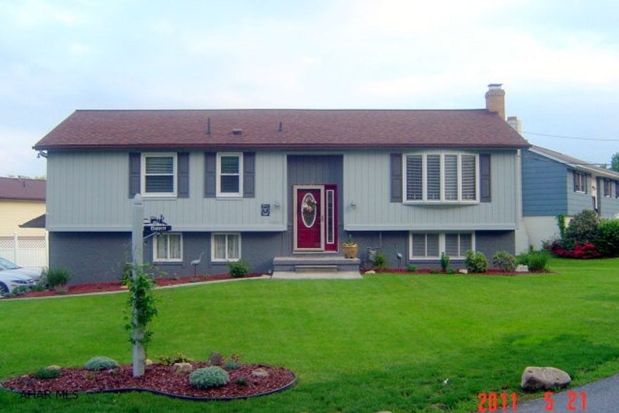 Eldorado Split Entry - 5001 Broad Ave. - 3BR, 2BA, LR & DR Vaulted Ceiling, E-In Kitchen - Appliances & Laminate Floor, 3 Season Sunroom, Family Room With Stone FP/Gas, C-Air, 2-Car Integral Garage, Storage Area Under Sunroom, Corner Lot 78.5 X 90 Irr.  $159,900 - Many Updates - Delayed Possession August 1, 2011.