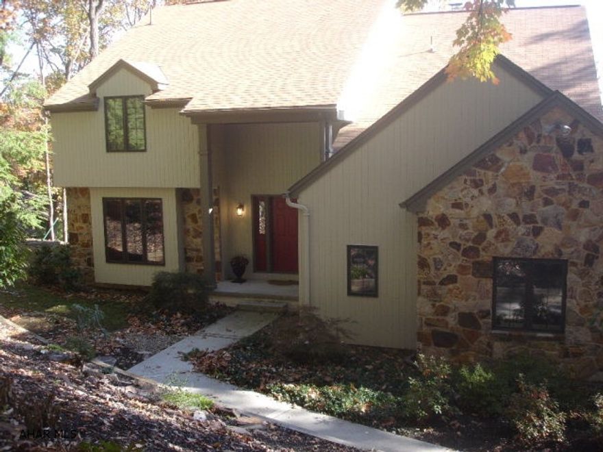 Open and spacious home with lots of light, hardwood floors, ceramic tile and a view. Great room with vaulted ceilings and stone fireplace. Enjoy all the work space and cabinets with marble counter top in the spacious kitchen with all appliances. Main level laundry, office on main level. Master suite with lots of closets. Full finished basement includes 5th bedroom and full bath. Plenty of storage and closets in this home. Deck to be stained when weather permits.