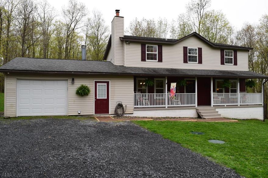 This beautiful four bedroom 2.5 bath home has been completely remodeled, it is  move in ready and situated on 5.4 wooded acres. A new hot water boiler was just installed on May 1st  and there is also the option to utilize the outdoor wood/coal burning furnace which is also tied into the main heating system. There is also a wood stove in the bonus room to take the chill off when it is not cold enough to run the main heating system. If you like privacy without being too far out, this home is for you. Call today and schedule your tour of this great property.