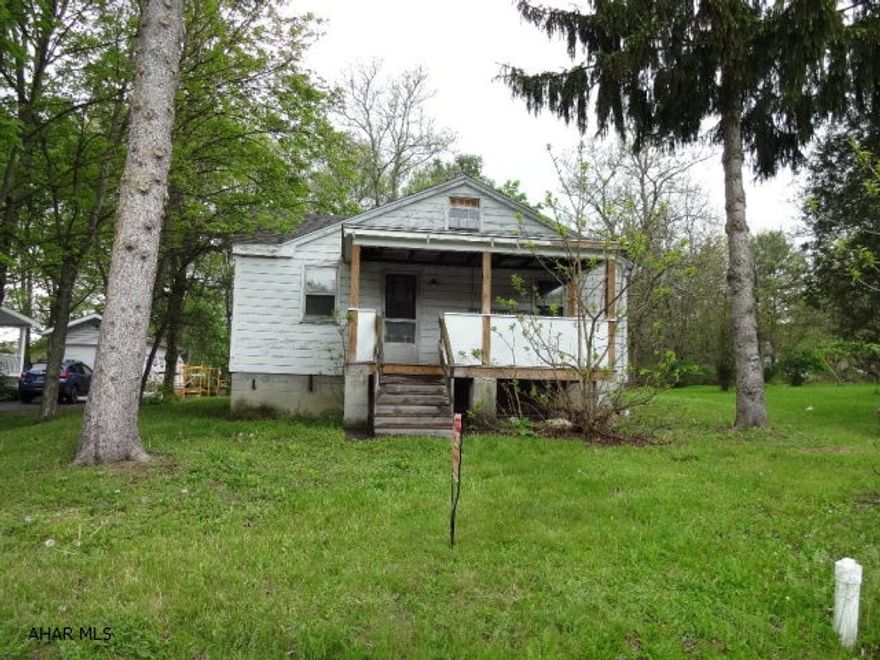 Location, Location, Location- One story house that is gutted with newer roof, porches and electrical service, being sold as-is