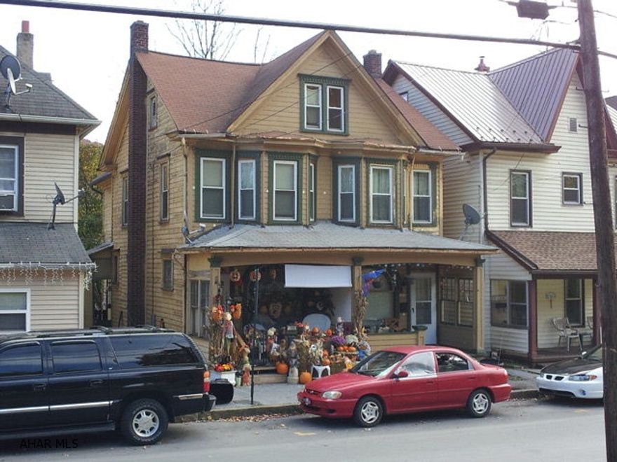 2 1/2 story double house with 3 bedrooms each side. Separate utilities. Convenient location. Good income.