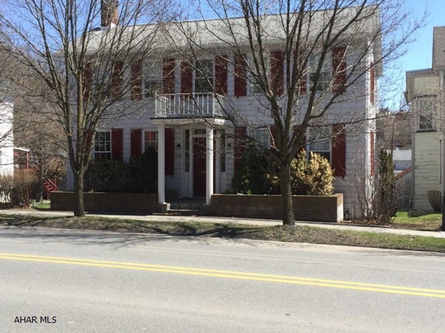 Great older 2-story home with lots of space and charm. Original pine wood floors, large rooms and ample storage. Sliding glass doors open up from family room onto partially covered and partially open deck for rain or shine. Large 2 car detached garage with additional off street parking. In town living at its best!