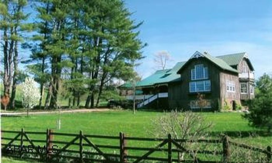 Picture perfect home and setting with 38 acres. Located in Houstontown, Fulton County. Very secluded unique property nestled in the foothills, lovely rolling fields, spring fed stream, two ponds. Part of the back of property is woods. Architectural designed board and batten home built in 1997 has many unusual features you must see to appreciate. Home has wood beams, kitchen has work island, breakfast nook with pond view, cathedral ceiling in great room and master bedroom loft, massive brick fireplace chimmey up thru great room, hardwood oak floors and ceramic tile flooring downstairs, yellow pine wood in loft, small balcony off of master bedroom, cedar closets, covered front porch and side deck.  Green metal roofs on the house and all the outbuildings. Milk house converted into summer kitchen, guest cottabge with water, electric and bathroom, barn has electric and water with stalls currently used for lambs, wagon shed and chicken coop, approx a mile of high tensile fencing on property. ALSO fabulous landscaping!