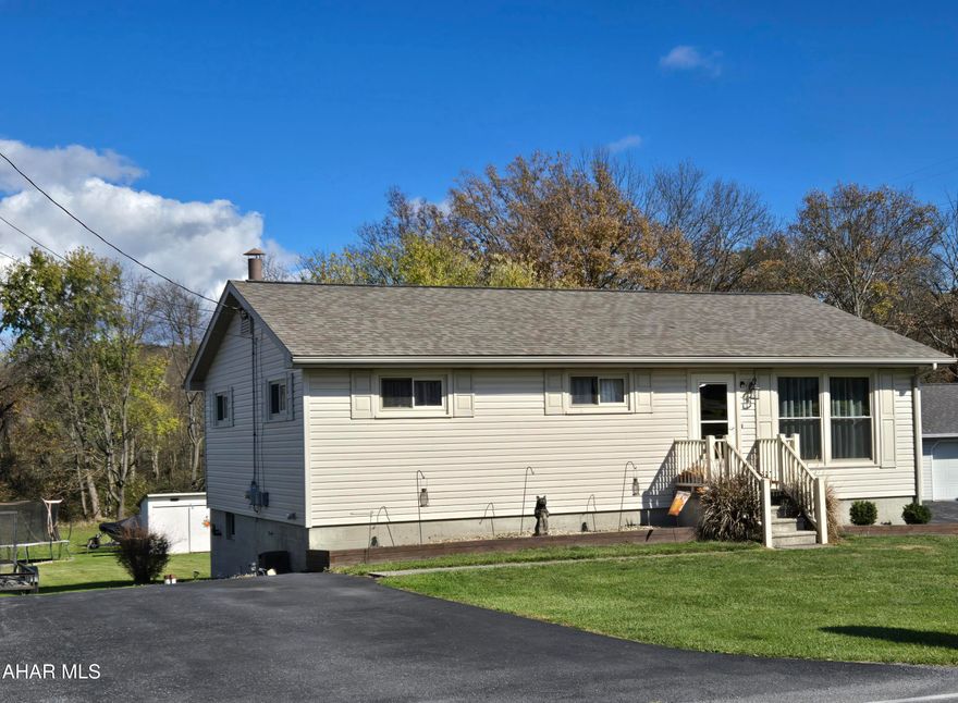 Great opportunity to live in the country in this 4-bedroom 1.5-bath 1-story vinyl-sided home with finished basement & back deck on .34 acres. Many upgrades completed by seller: vinyl siding, windows, exterior doors + screen doors, deck, oil furnace, public sewer, updated kitchen + bath. Shingle roof (in 2022) and added central air (in 2023). J-676
