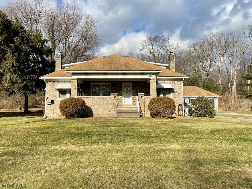 Beautiful solid stone home on 2.8 acres with mature trees and privacy.  Conveniently located with easy access to Huntingdon Country Club, restaurants, shopping and just minutes to Raystown Lake. This home boasts a large stone three-car detached garage and several outdoor storage sheds with endless possibilities.  Enjoy the convenient attached carport with sitting area for ease of unloading your car and watching wildlife from the sitting area. The First floor master suite has an additional adjoining room that could be used as large walk-in closet or office area. Two large bedrooms on second floor with loads of closet space. Living and Dining room are open and include beautiful cherry woodwork. Call to schedule your private showing and start making memories today.