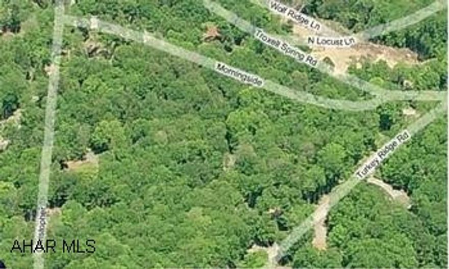 Beautiful corner 3 lots, approx 1 1/2 acres.  GATED COMMUNITY.  Close to the new baseball / soccer fields.Close to fishing pond, pool, tennis & much more.  Build on one and divide the other 2 to sell.