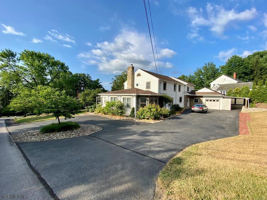 There is room for everyone in this beautiful 5 bedroom, 4 bath home with second floor master suite and first floor mother-in-law suite.  It boasts a large family room with wood ceiling, lots of windows, and exposed stone wall with access to the three-season sun room .  Enjoy those summer mornings on the large front porch.  Efficient lay out with large mudroom and  entrance to private stone patio, and first floor laundry.  Stay warm with the wood fireplace in the living area on those crisp fall evenings.   Many extras to make for worry free maintenance.  Situated on  a large corner lot in Taylor Highlands, easy commute to State College and within walking distance of schools, college, walking trails, and the heart of Huntingdon.  Large basement with a lot of potential.